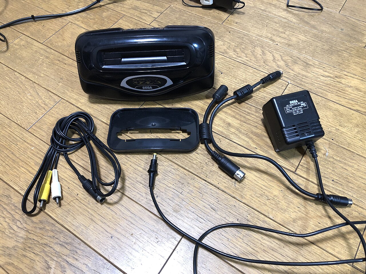 The Super 32X with its cables and pass-through parts