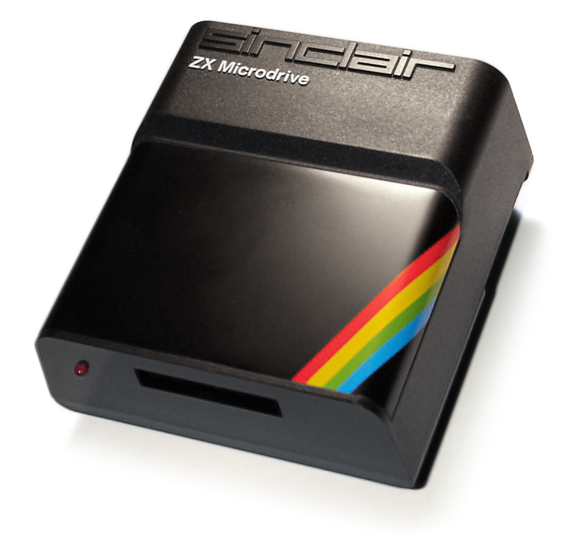 An original Sinclair ZX Microdrive unit with rainbow stripe