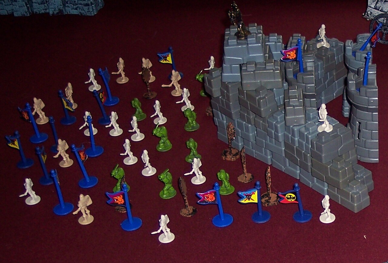 A plastic castle and toy soldiers from the 2007 Battleground revival of Crossbows and Catapults