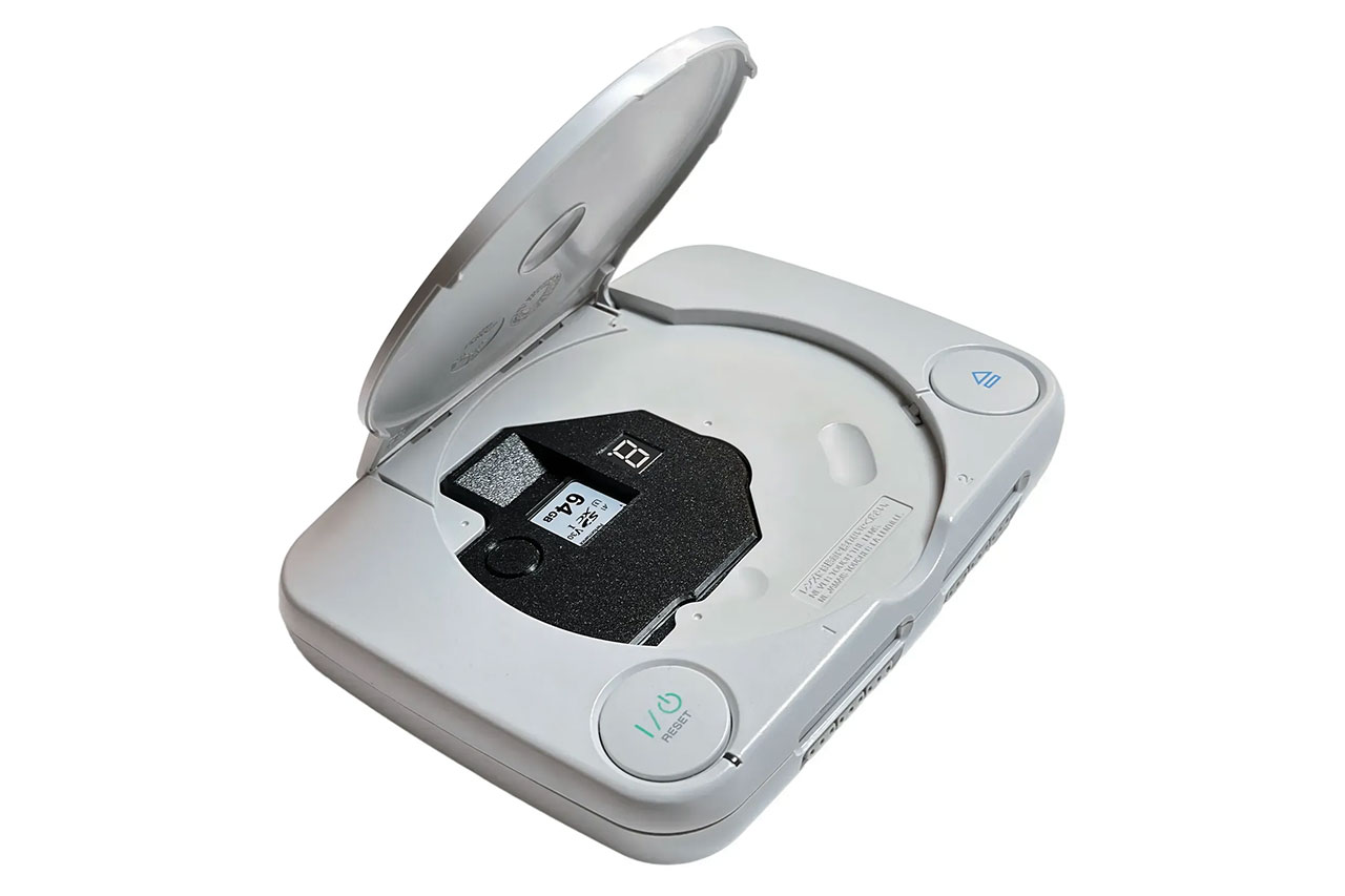 ArcStation ODE installed inside a PSone with the lid open, showing the SD card slot and LED display