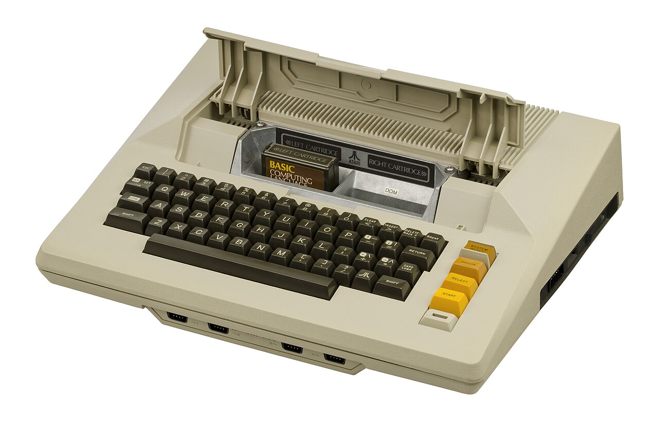 The Atari 800 opened, showing its internal module bays