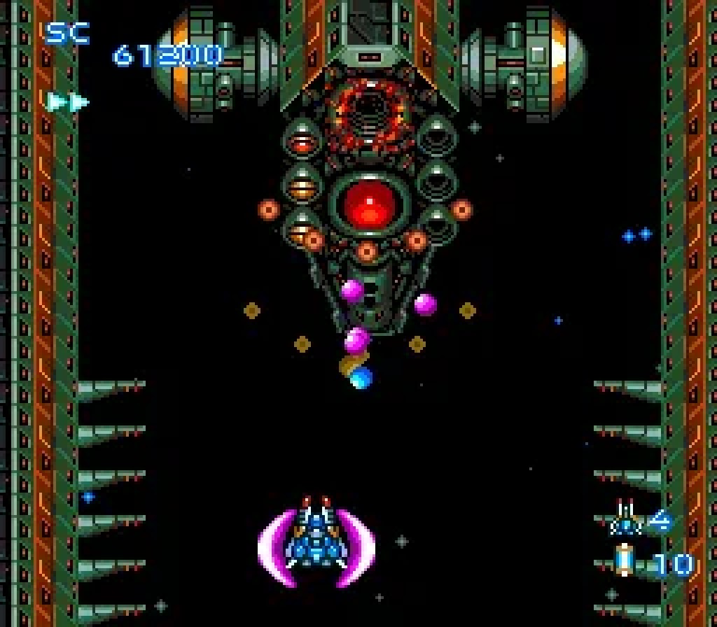 A Blazing Lazers boss encounter, the player's shielded ship facing a large mechanical fortress