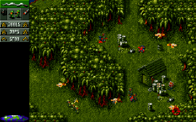 Cannon Fodder on the Amiga — a squad of tiny soldiers advancing through jungle terrain