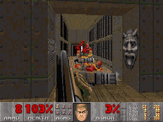 DOOM II gameplay screenshot, first-person view in a hellish corridor