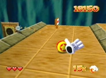 Glover on Nintendo 64 — the living glove character beside his ball on a tiled course