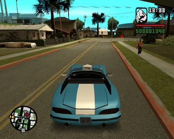 Hand holding DualShock 4 controller in front of PS2 connected to an LG OLED TV with GTA San Andreas load screen.