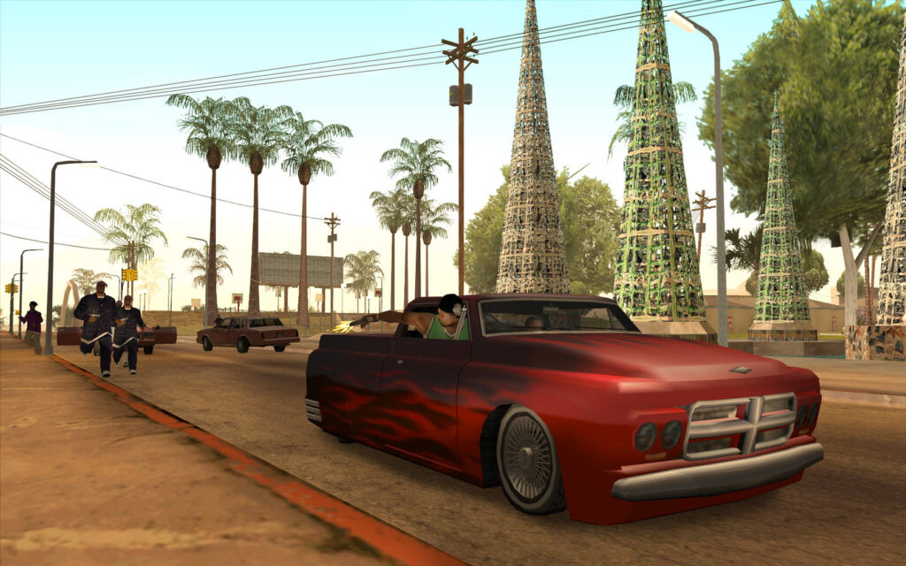 Grand Theft Auto: San Andreas — a red lowrider on a Los Santos boulevard