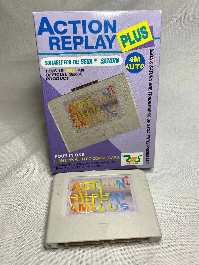 An Action Replay Plus 4M Auto cartridge with its retail box, the essential import and RAM expansion accessory for the Sega Saturn