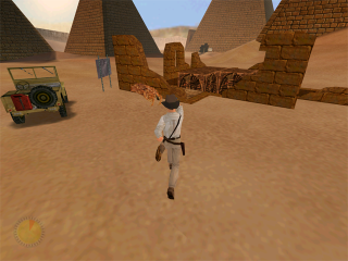 Indiana Jones and the Infernal Machine on Nintendo 64 — Indy exploring desert ruins with pyramids behind him