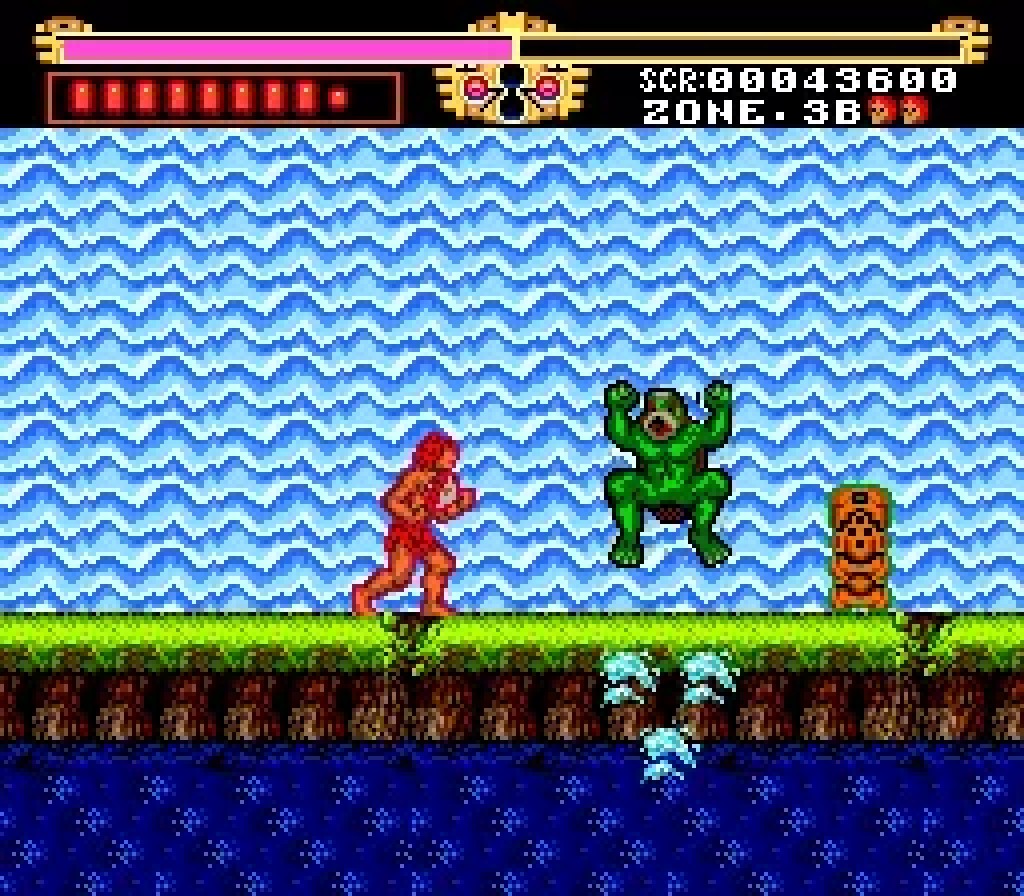 Gogan facing a frog-man beside the water in The Legendary Axe