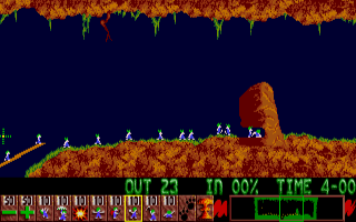 Lemmings gameplay — a trapdoor releasing lemmings above a rocky level with a digger at work