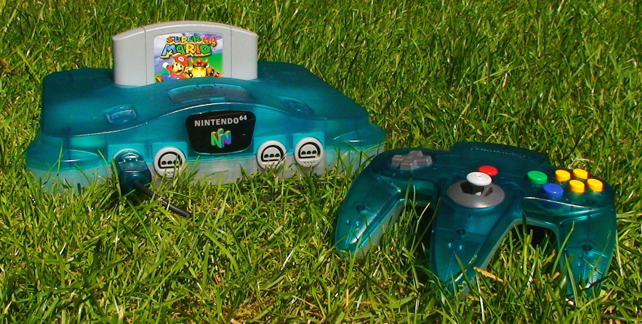 A clear-blue Nintendo 64 with a Super Mario 64 cartridge.