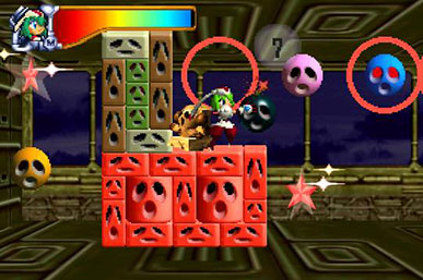 Mischief Makers on Nintendo 64 — Marina grabbing a bomb among the sad-faced Clanball blocks